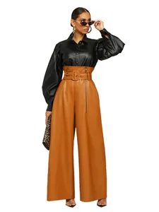 Full length studio shot of high-waisted brown faux leather wide-leg pants on model