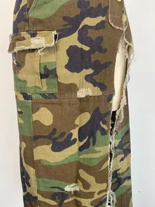 Detailed macro shot of women's camouflage skirt featuring distressed hems and cargo pockets