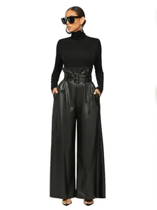 Full body detail of elegant high waisted black PU leather wide leg pants with belt