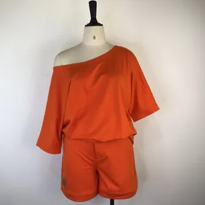 Vibrant orange off-shoulder two-piece loungewear set with loose top and shorts
