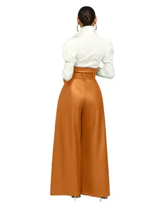 High-waisted orange PU leather wide-leg pants for women featuring a matching waist belt