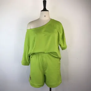 Lime green two-piece loungewear set featuring an off-the-shoulder top and shorts