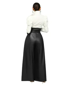Back view of elegant women's high-waisted black PU leather wide-leg trousers