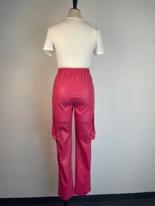 Back view of vibrant pink PU leather cargo pants with side pockets and elastic waist.