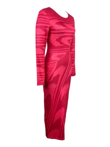 Side view of long-sleeved bodycon maxi dress featuring bold pink irregular prints
