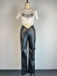Detail of black PU leather straight-leg cargo pants featuring low-waist V-cut design
