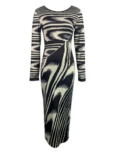Detailed view of the irregular black and white wave print on this long-sleeved dress