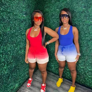 Close-up of vibrant red and blue gradient racerback tank and matching shorts on models