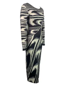 Detailed view of the irregular black and white abstract print on this long sleeve bodycon dress.