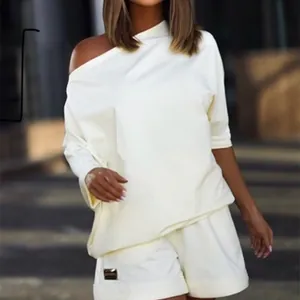 Trendy white off-shoulder sweatshirt and shorts set for women in a relaxed loose fit