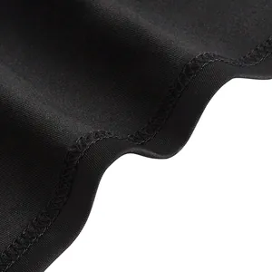 Detailed close-up of high elastic black fabric showing fine stitching and mesh texture