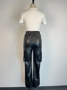 Detailed back view of black faux leather cargo pants on mannequin showing the fit.