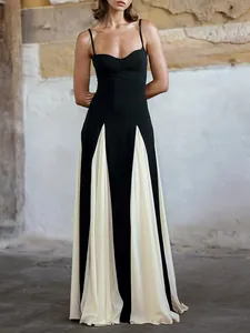 Elegant floor-length black and white patchwork evening gown with spaghetti straps