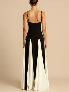 Back view of elegant black and white spliced maxi evening dress with spaghetti straps