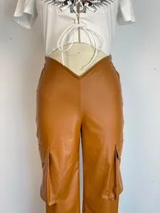 Detailed view of women's brown PU leather cargo pants with unique V-shaped low waistline