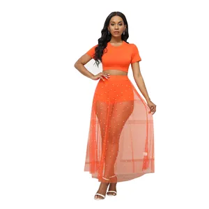 Completo da spiaggia arancione tre pezzi con gonna in mesh perlato e crop top