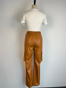 Detailed back view of brown PU leather cargo pants with side pockets and elastic waist on mannequin
