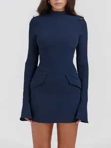 Detailed view of a navy blue long-sleeved high-neck mini dress with flap pockets.
