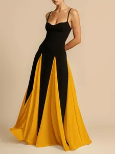 Elegant spaghetti strap evening gown with black and yellow color-block pleated skirt