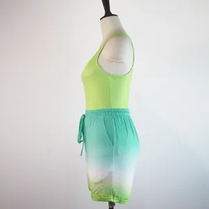 Close-up side view of women's racerback tank top and ombre gradient sports shorts set
