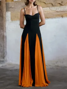 Elegant black and orange color-block maxi evening dress with pleated panels and spaghetti straps