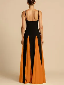 Detailed back view of an elegant black and orange color-block spaghetti strap maxi dress.