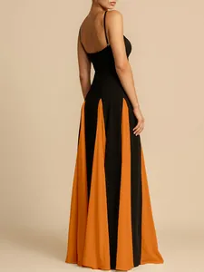 Elegant backless evening dress with black and orange pleated flared skirt detail view