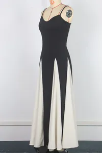 Elegant black and white spliced evening gown with spaghetti straps shown on mannequin
