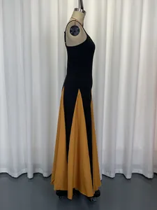 Side view of an elegant black and yellow color-block patchwork maxi dress on mannequin
