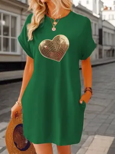 Casual green mini dress for women featuring a large gold sequin heart on the chest