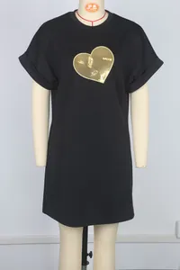 Detailed view of black casual mini dress with golden sequined heart embroidery on mannequin
