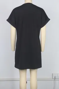 Back view of black casual short sleeve drop shoulder loose mini dress for women