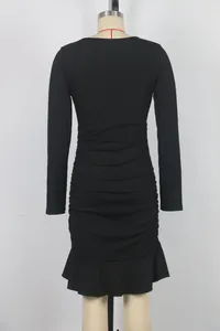 Detailed back view of a black long-sleeved ruched dress featuring a ruffled hemline