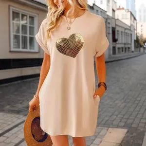 Elegant beige casual T-shirt dress featuring a gold sequin heart design for women