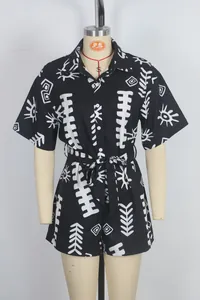 Summer short sleeve romper with shirt collar and white tribal print on black fabric