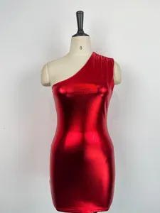 Macro view of the metallic red fabric on a sexy one-shoulder bodycon mini dress.