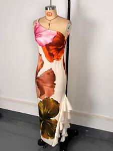 Detail of one-shoulder floral maxi dress with elegant ruffle hem and backless design