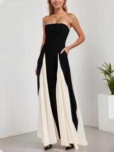 Full-length view of a sexy color-block strapless maxi dress for evening wear