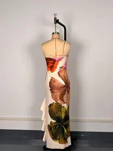 Back view of elegant floral print one-shoulder maxi dress with ruffle hem detail for women