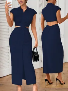 Front and back view of a navy blue cutout midi dress with stand collar and buttons.