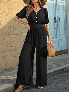 Full view of elegant black jumpsuit with short puff sleeves and wide leg trousers