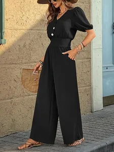 Elegant black short-sleeved jumpsuit with elastic waist and wide-leg fit for women