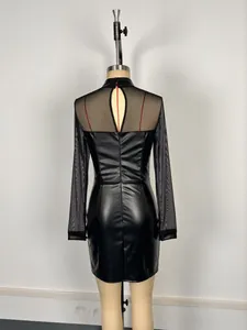 Rear view detail of black faux leather mini dress with sheer mesh back and sleeves