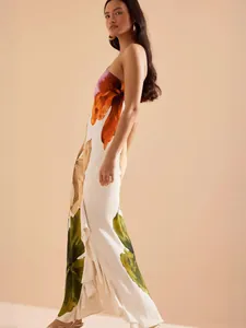 Elegant floral maxi dress with ruffled hem and backless design for beach vacation