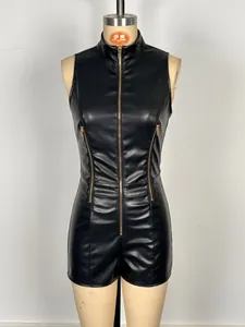 Detail view of a black sleeveless faux leather romper with stylish gold front zipper.