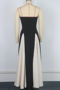 Back view of sexy black and white color-block bandeau maxi evening dress on mannequin