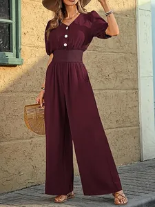 Elegant burgundy short-sleeve jumpsuit with a smocked waist and wide-leg trousers
