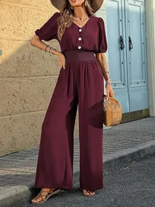 Elegant maroon short sleeve jumpsuit with wide leg pants and elastic waist detail
