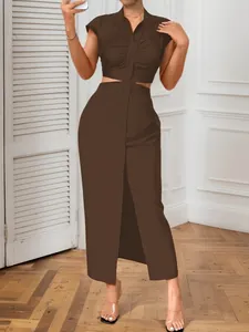 Detailed view of a sexy dark brown cutout waist maxi dress with stand collar and buttons.