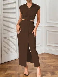 Full view detail of a brown sexy cut-out maxi dress with button-front and stand collar design